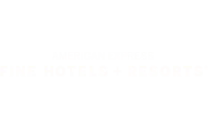 American Express Fine Hotels + Resorts logo. logo on footer section. Link to external website.