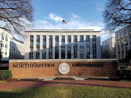 It's a building with the sign "Northeastern University" and an American