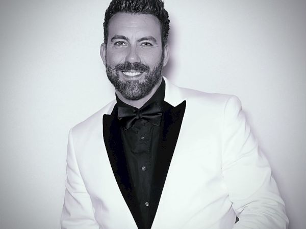 Black and White Photograph of Steve Memmolo in a suit