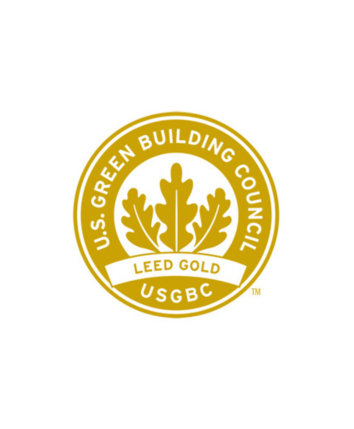 This image shows the U.S. Green Building Council seal for LEED Gold certification, featuring a leaf design and circular text arrangement.