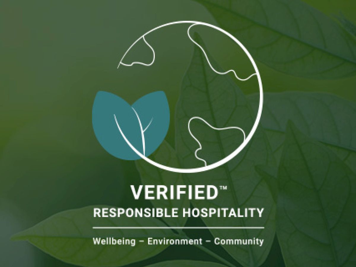 The image shows a logo featuring a globe and leaves with the text "VERIFIED RESPONSIBLE HOSPITALITY," focusing on wellbeing, environment, and community.